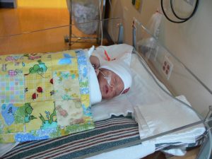 The little quilt is handmade by a grandmother of one of the nurses who makes them and donates them to the NICU. We will get to take it with us when we leave, and it will be nice for travel use. His Grandmother Killian has already made him a much larger quilt we will use at home! (Thanks Grandma!)